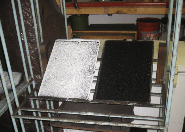 Laboratory apparatus used to evaluate dust suppressants under simulated environmental stresses